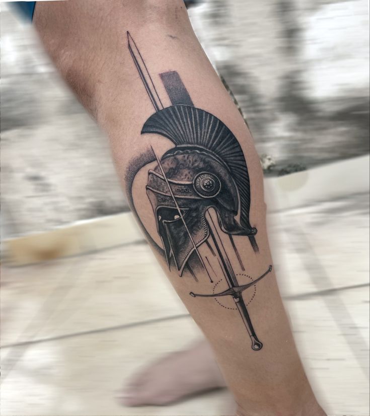 a man's leg with a roman soldier tattoo on it