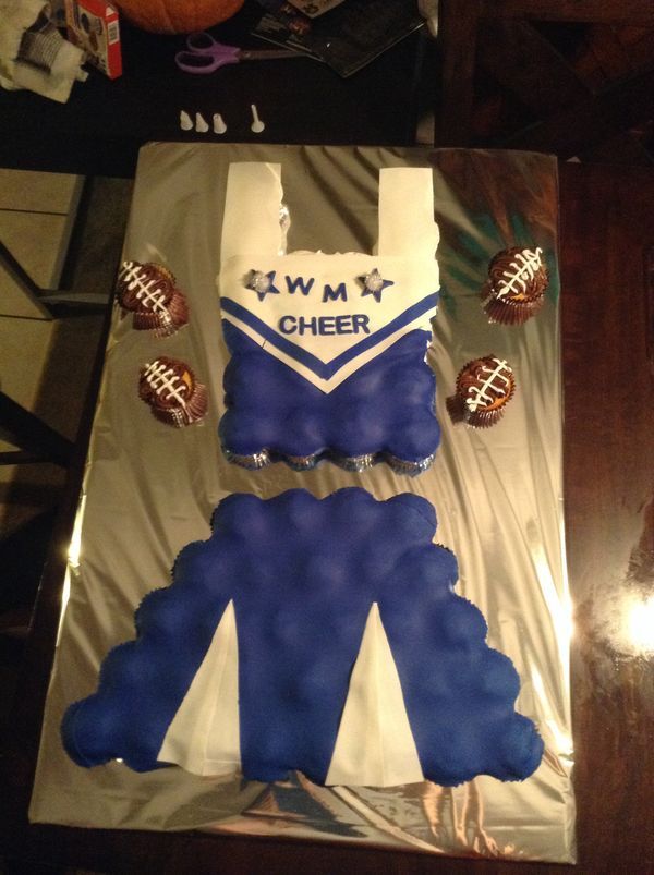 a cake that is shaped like a cheerleader