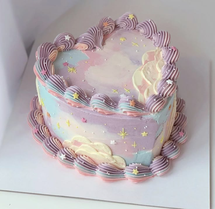 there is a cake that looks like it has been decorated with pastel icing