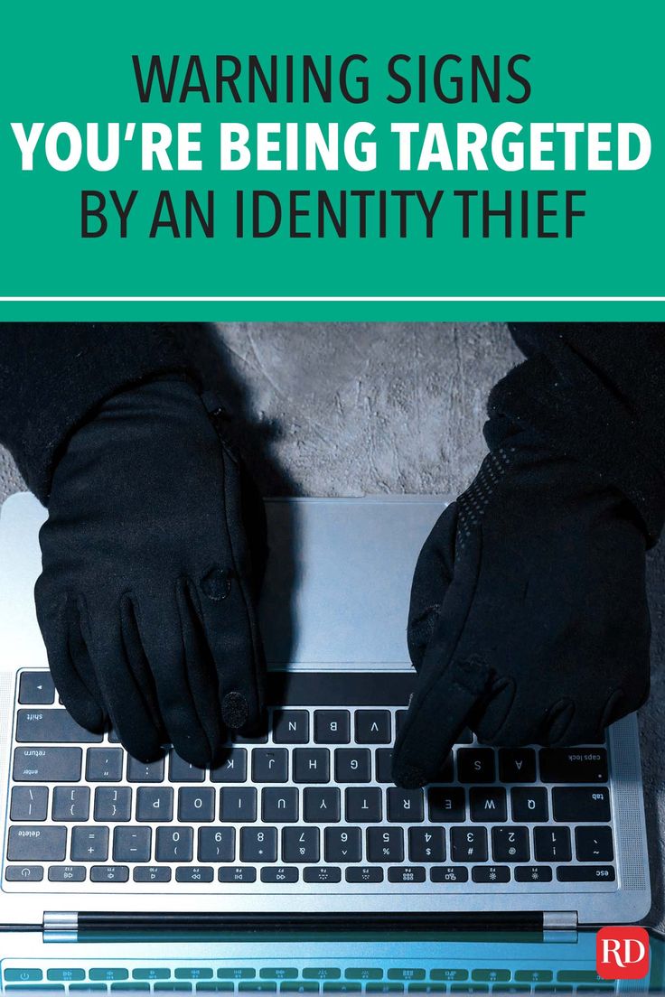 a person typing on a laptop computer with the caption warning signs you're being targeted by an identity thief