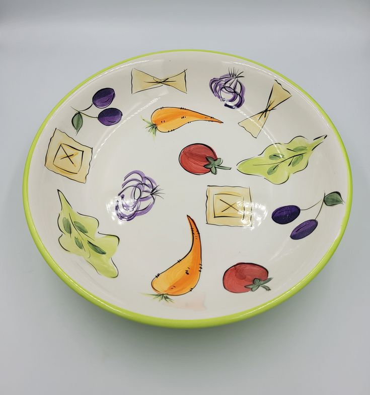 a bowl with vegetables painted on it