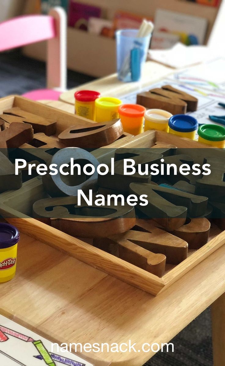 a child's art table with wooden letters and paints on it that says preschool business names