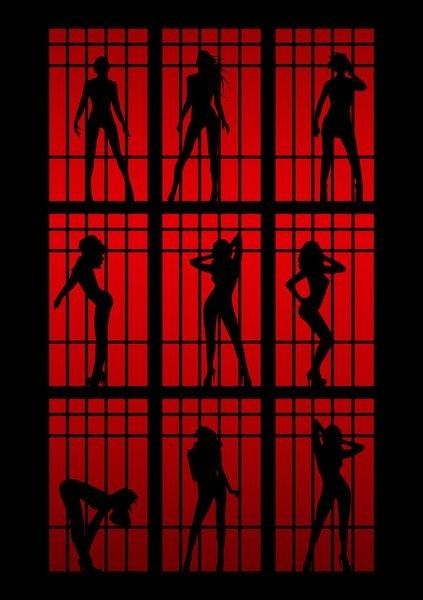 the silhouettes of people behind bars in jail cell