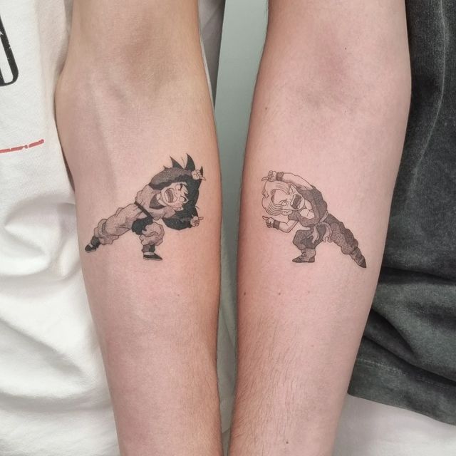 two people with matching tattoos on their arms