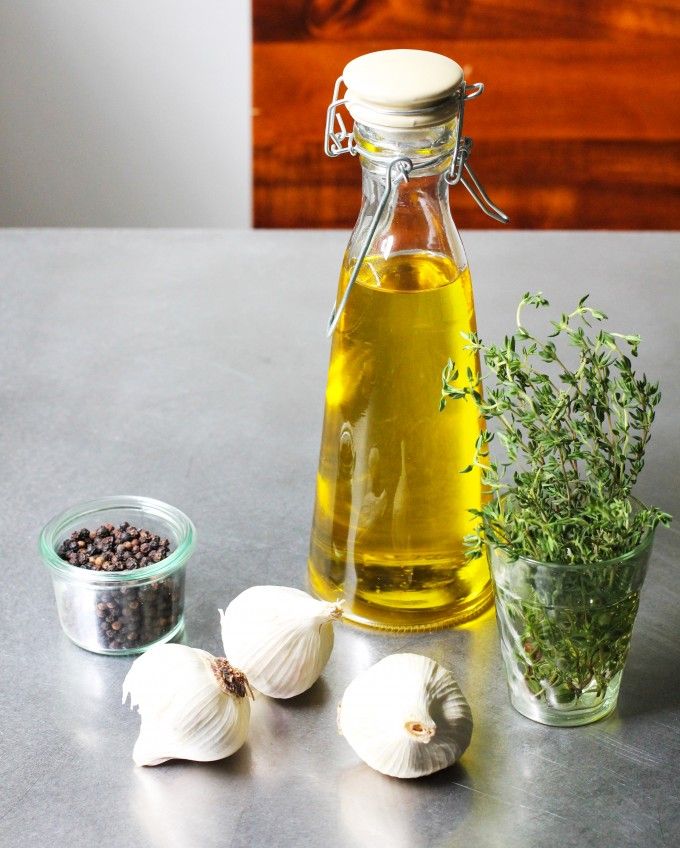 garlic, herbs and oil on a table