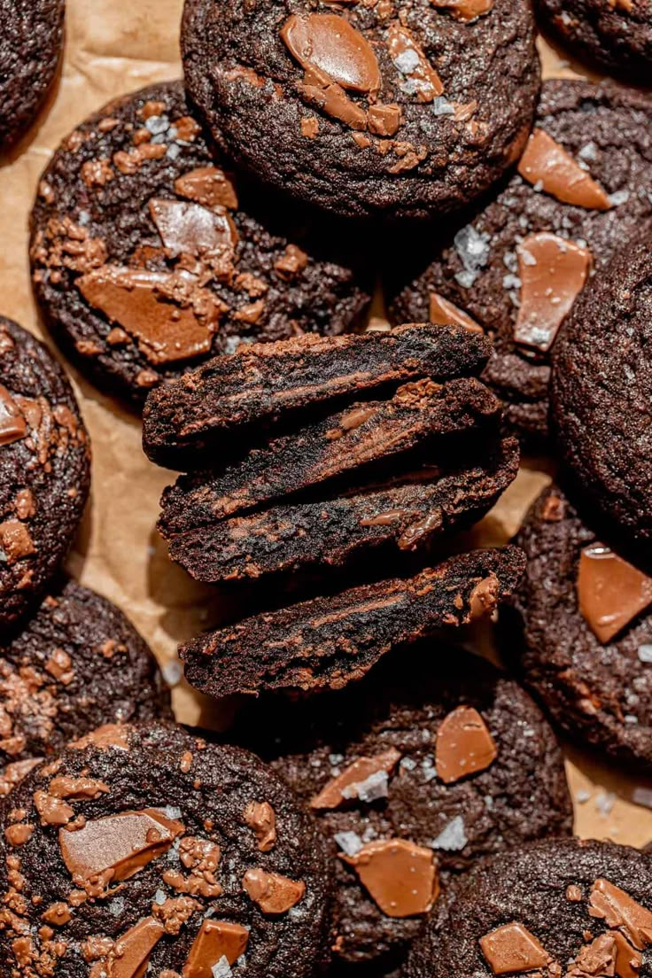 chocolate cookies are piled on top of each other