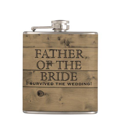 a wooden flask with the words father of the bride printed on it