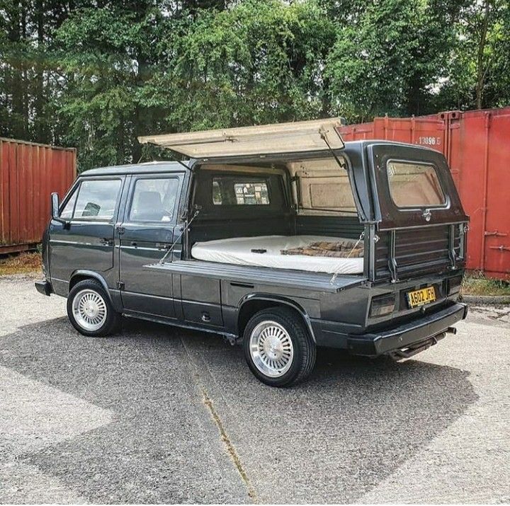 an old car is parked in the parking lot