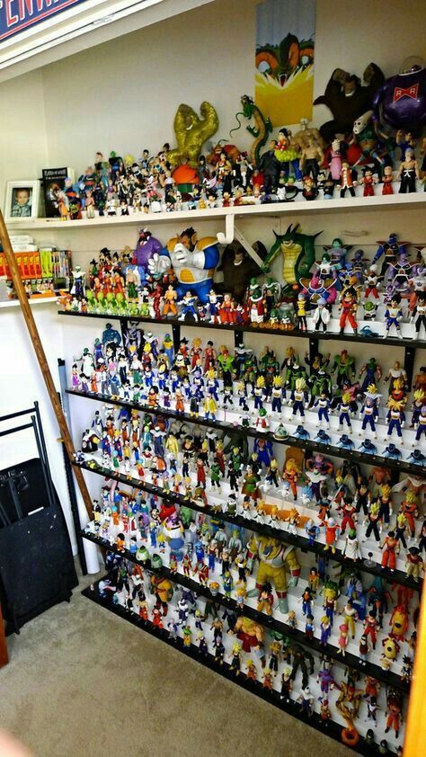 a room filled with lots of toy figurines on shelves