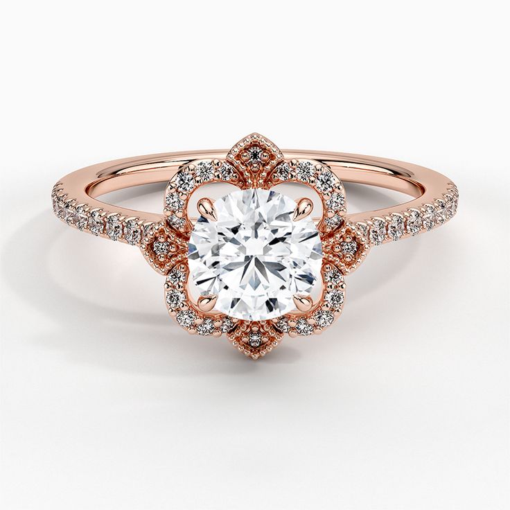 a rose gold engagement ring with diamonds on the band