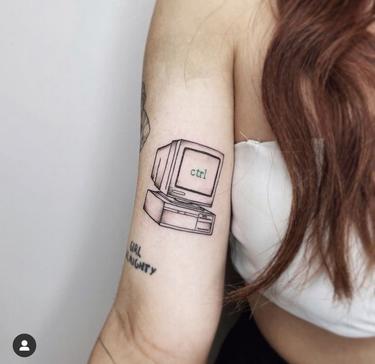 a woman with a computer tattoo on her arm