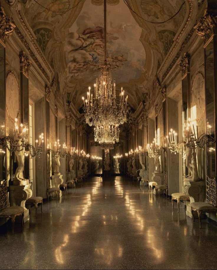 an ornate hallway with chandeliers and mirrors