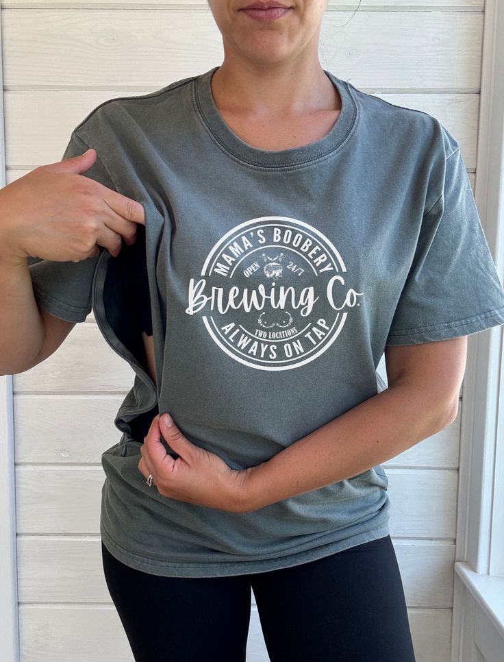 Our nursing friendly acid wash tees with Mama's Boobery Brewing Co. graphic is a game changer for breastfeeding mothers. All of our products are designed for comfort and convenience by a breastfeeding mother of three littles with functionality in mind. Made from 100% cotton and hand dyed, this t-shirt is lightweight and comfortable - perfect for warmer days to keep you cool. Great to be used for all seasons and is a loose fit style. Two convenient zippers on either side, easy to quickly zip open Nursing Friendly Outfits Summer, Nursing Friendly Clothes, Breastfeeding Shirts, Nursing Friendly Outfits, Nursing Friendly Tops, Breastfeeding Shirt, Friendly Outfits, Breastfeeding Mom, Breastfeeding Clothes