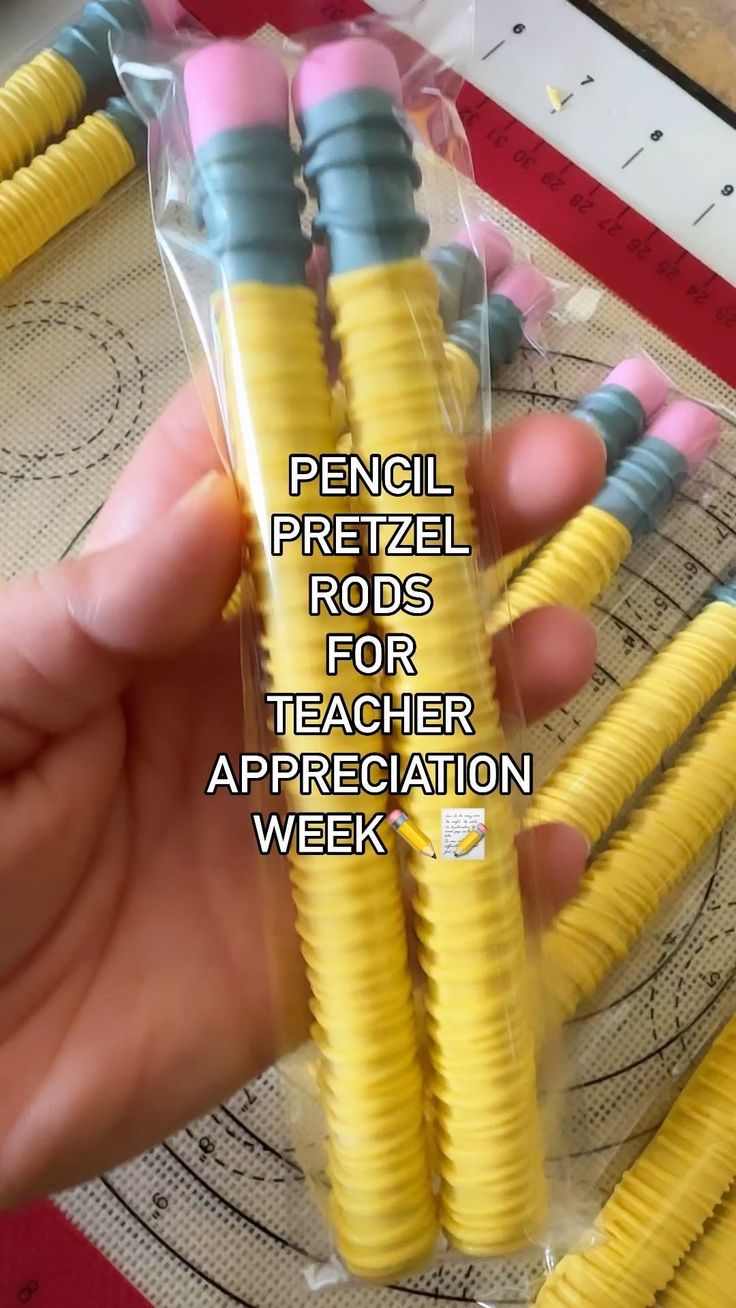 a person is holding some yellow and blue pencils in their hand with the words pencil pretzel rods for teacher appreciation week