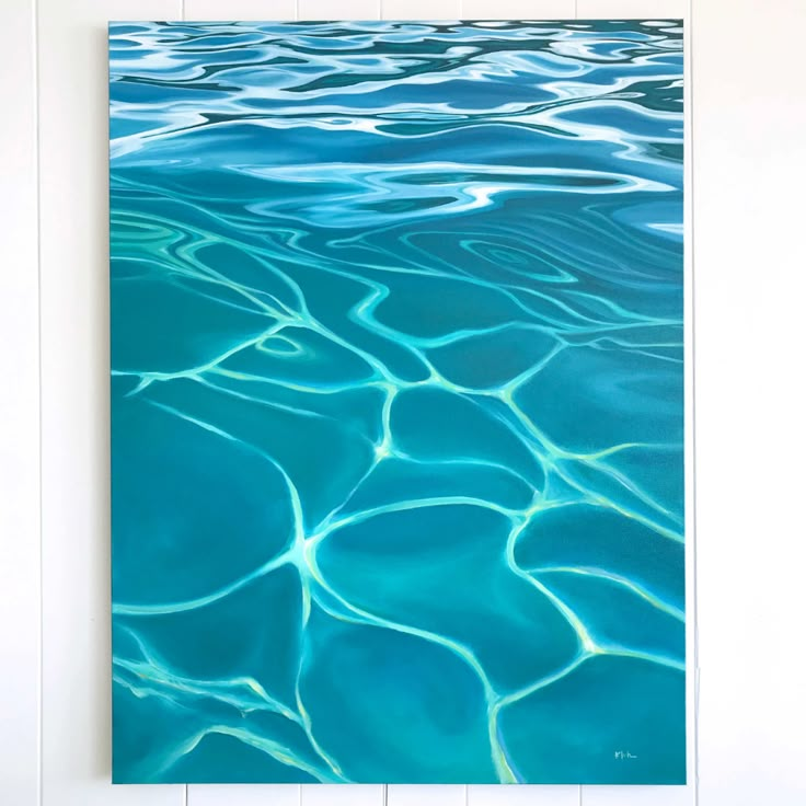 an abstract photograph of blue water with ripples in the water and white planks on the wall