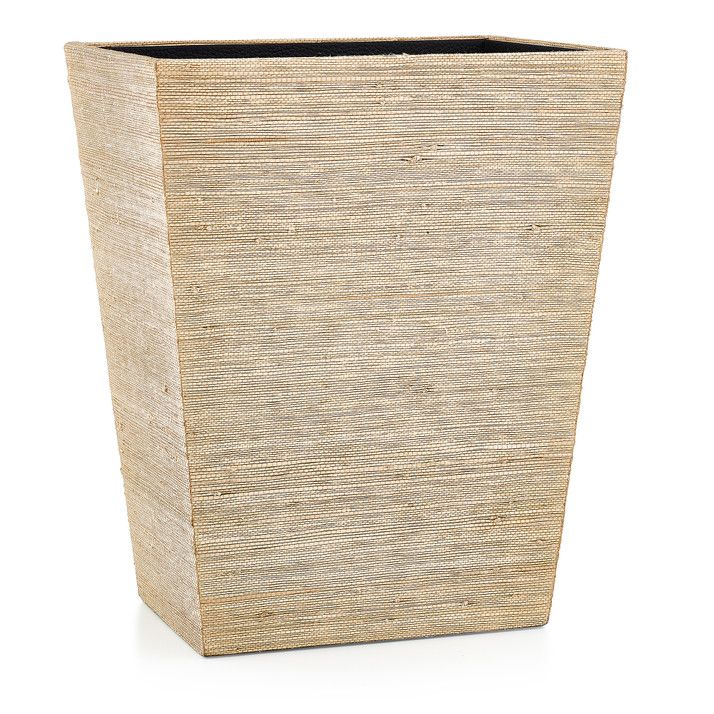 a square planter made out of straw with a black liner on the top and bottom