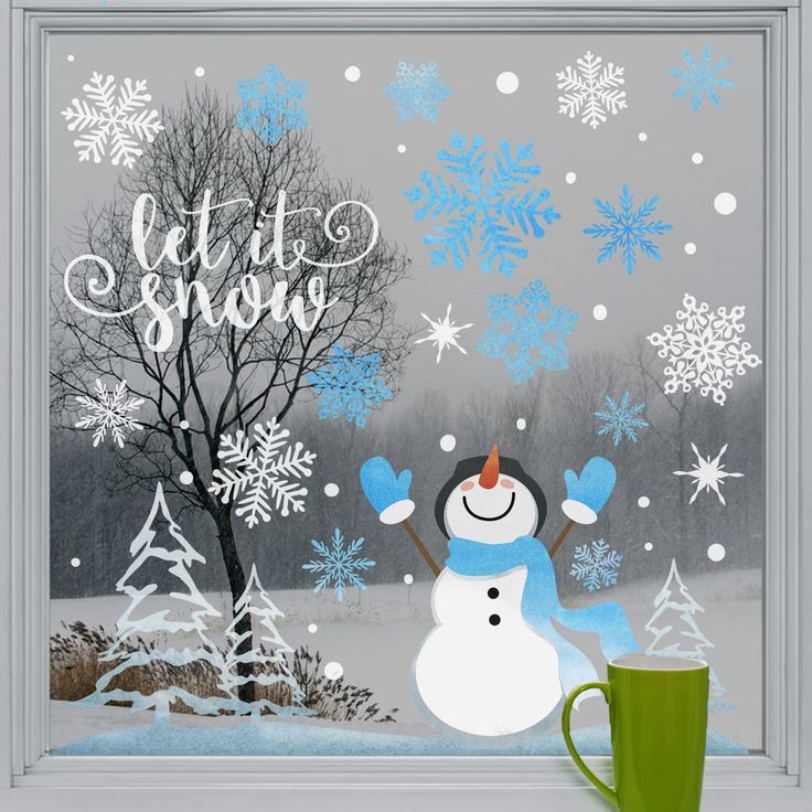 a frosty window with a snowman and tree in the background that says let it snow