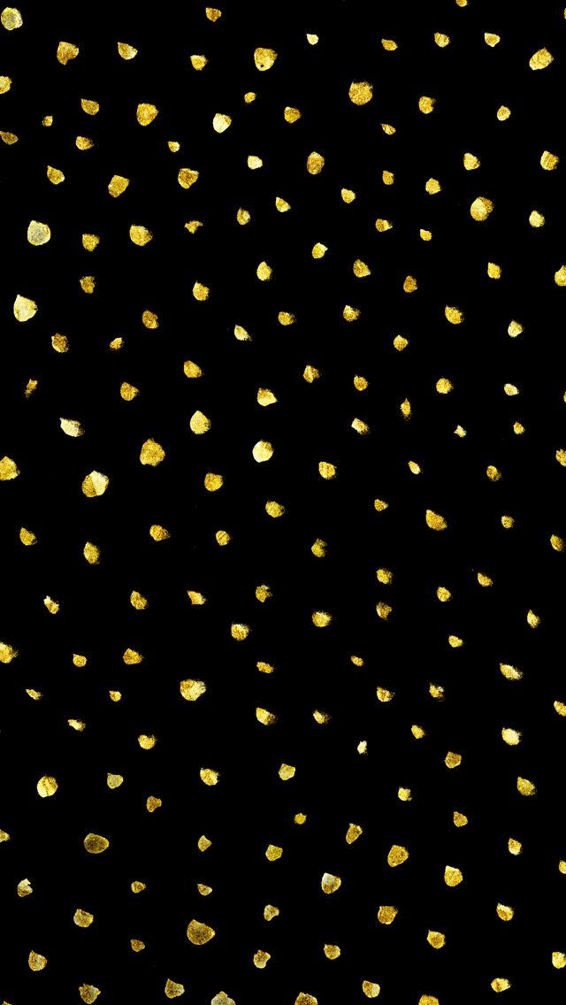 gold glitter confetti on a black background