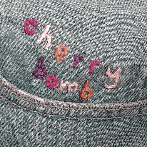 the letters are embroidered onto some jeans