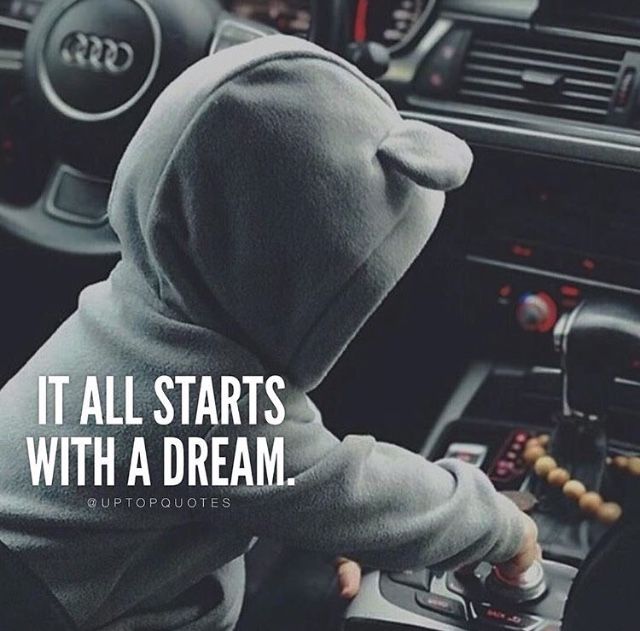 a person in a hoodie driving a car with the words it all starts with a dream