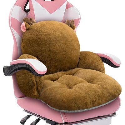 a chair that has a stuffed animal on it's back and is in the shape of a cat