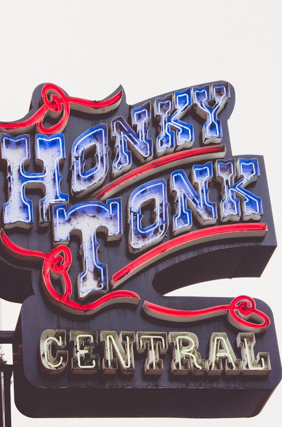 a neon sign that says honey stone central