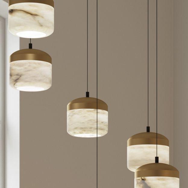 five lights hanging from the ceiling in a room