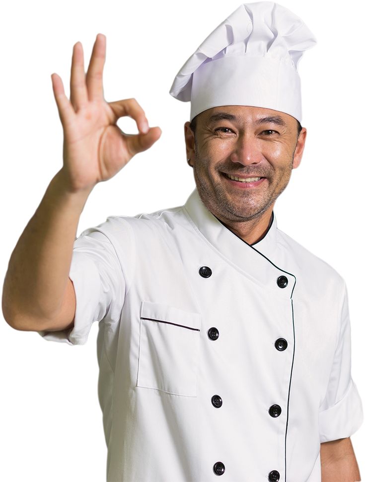 a man in a chef's outfit making the peace sign