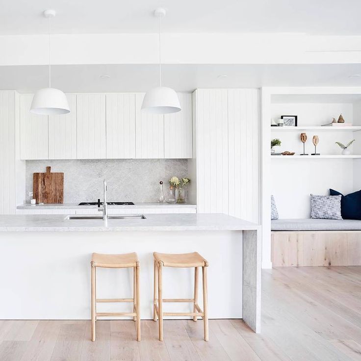 two stools sit in front of the kitchen island