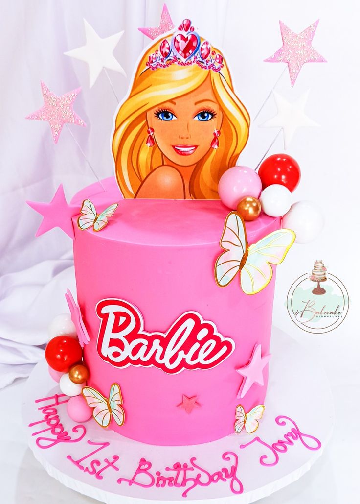 a barbie birthday cake with pink frosting and stars around it, on a white background