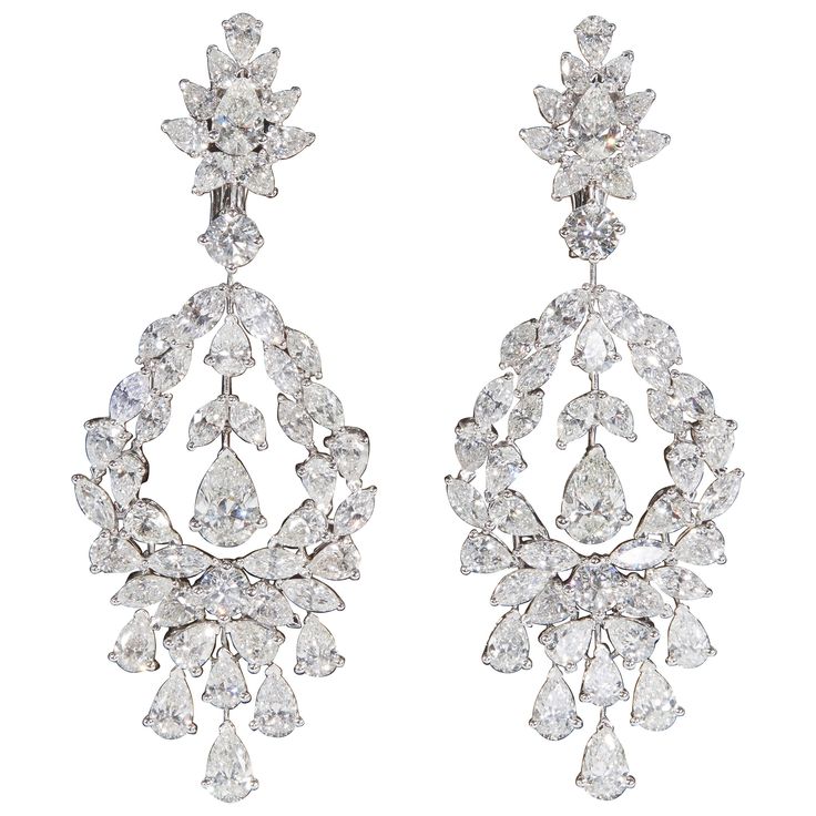 Beautiful diamond drop earrings in a stunning design. 22.05 carats of diamonds, the center pear shape drops measure as carat sizes. 18k white gold Approximately 2.63 inches in length, an inch wide at its widest point. Made in New York Antique Diamond Earrings, Carat Sizes, Diamond Chandelier Earrings, Diamond Chandelier, Earrings Diamond, Vs Diamond, Antique Diamond, Diamond Drops, Diamond Drop Earrings