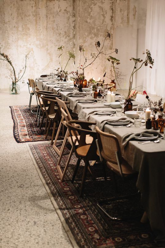 a long table is set up with place settings