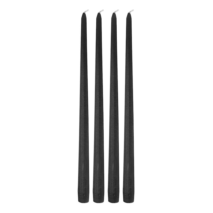 three black candles sitting next to each other