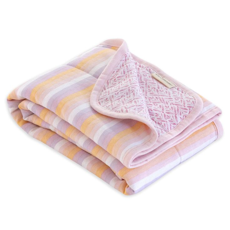 three blankets stacked on top of each other with pink and yellow stripes in the middle