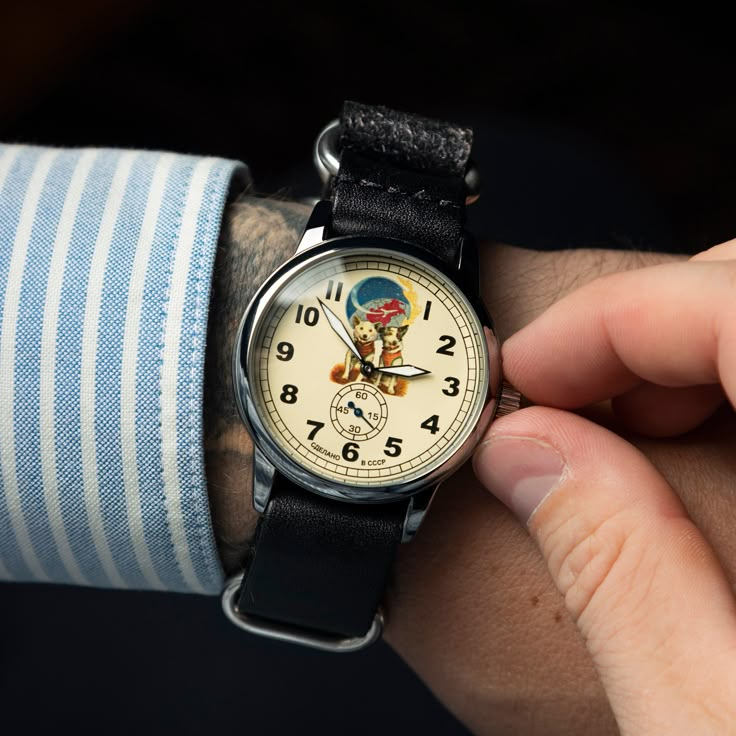 Belka and Strelka are Soviet cosmonaut dogs that flew in the Sputnik 5 spacecraft on August 19, 1960. Pobeda watches were always in great demand, but few could afford them at that time. They were produced after World War II, at the first official watch factory in Moscow, Kirov, in 1946. This watch made a real sensation among connoisseurs of the classic sustained style. They have been worn and continue to be worn for decades and passed down from generation to generation. Year: 1970 Case size: 40 Luxury Vintage Chronograph Watch With Analog Display, Vintage Watches 70s, Soviet Space Dogs, Belka And Strelka, Russian Dogs, Space Dogs, Unique Gifts For Dad, Space Dog, Retro Watches