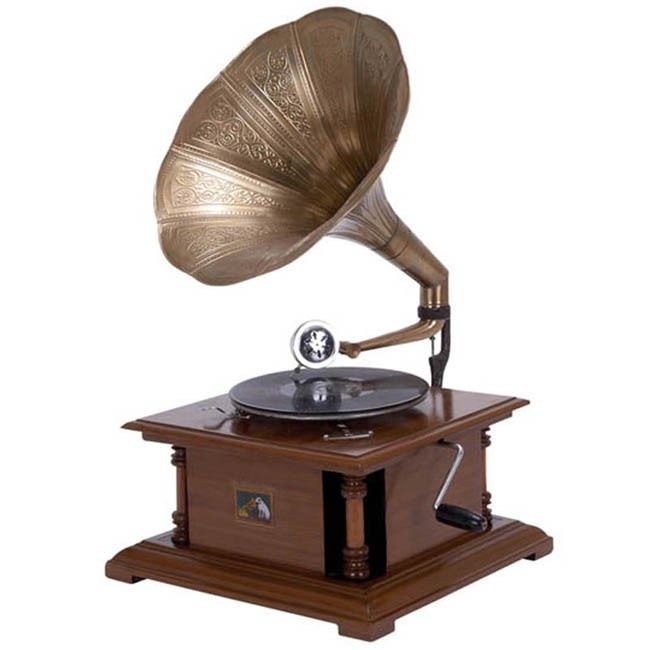 an old fashioned record player on top of a wooden stand with a gold plated phonograph