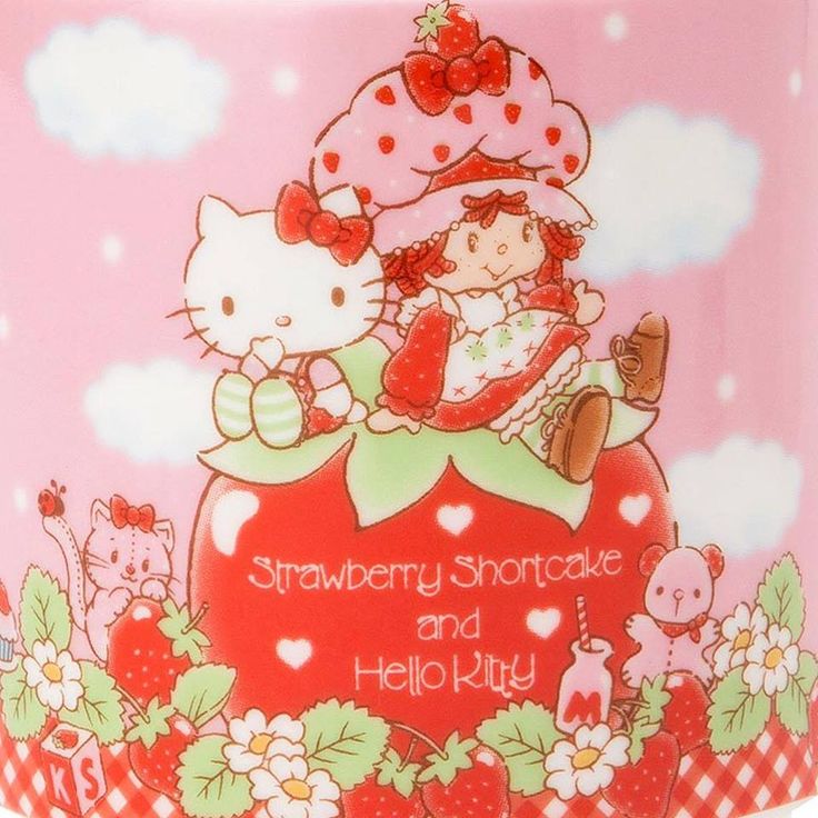 a strawberry shortcake and hello kitty mug