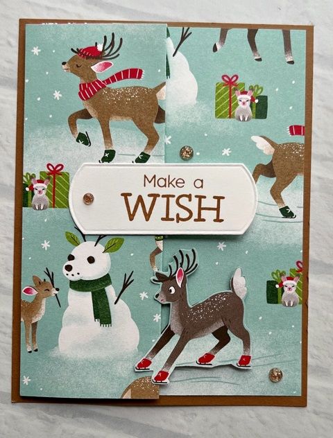 a handmade christmas card with reindeer and snowman on it, which says make a wish