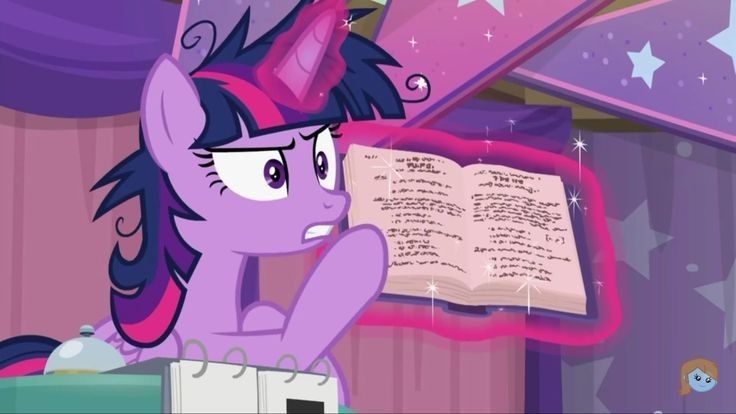 the pinkie is looking at an open book