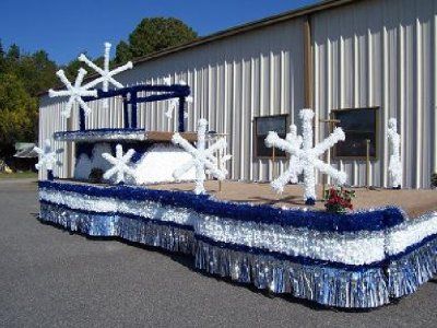 a float made to look like a boat with snowflakes on it