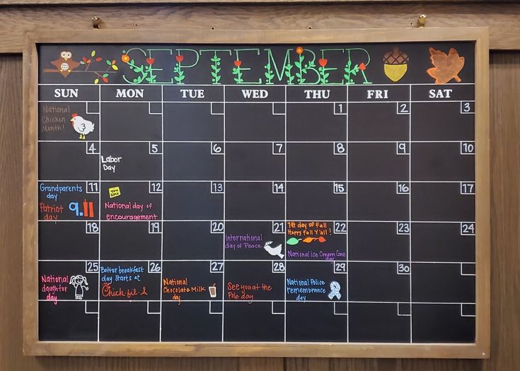 a chalk board with the calendar written on it