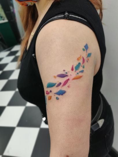 a woman with a colorful tattoo on her arm