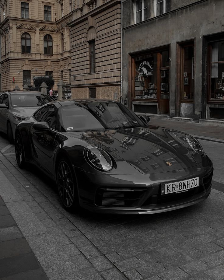 a black sports car parked on the street