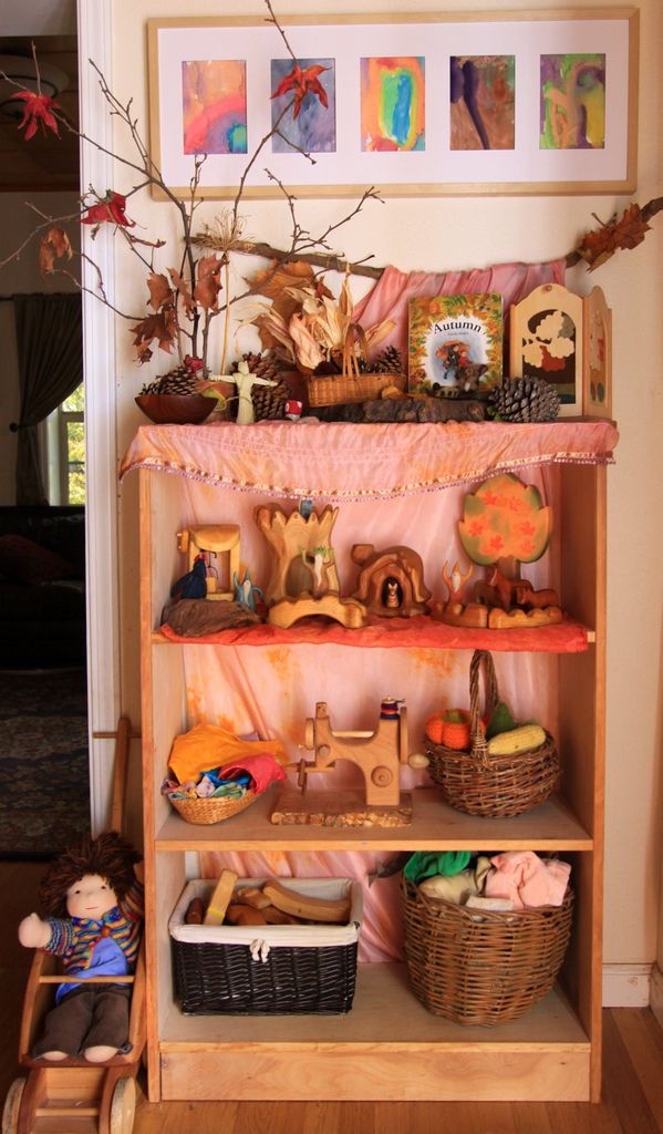 a wooden shelf filled with lots of toys