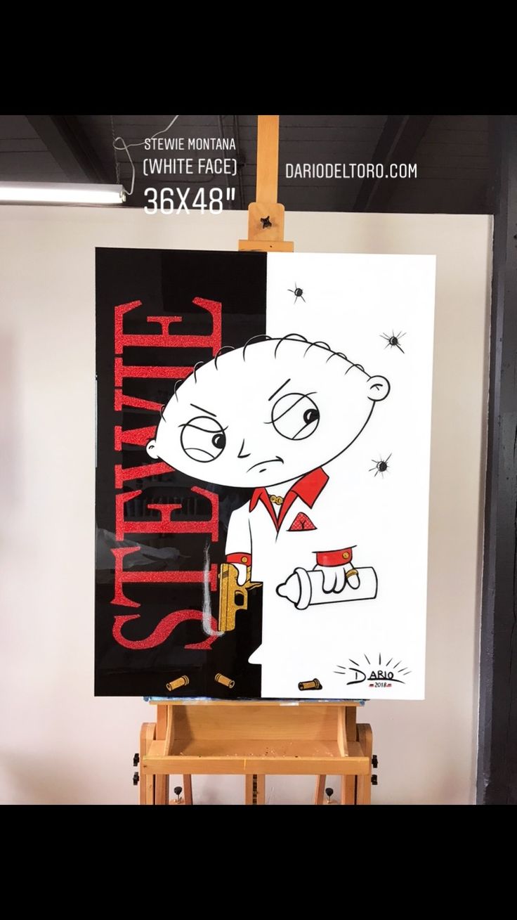 a poster is hanging on the easel in front of a white wall and black background