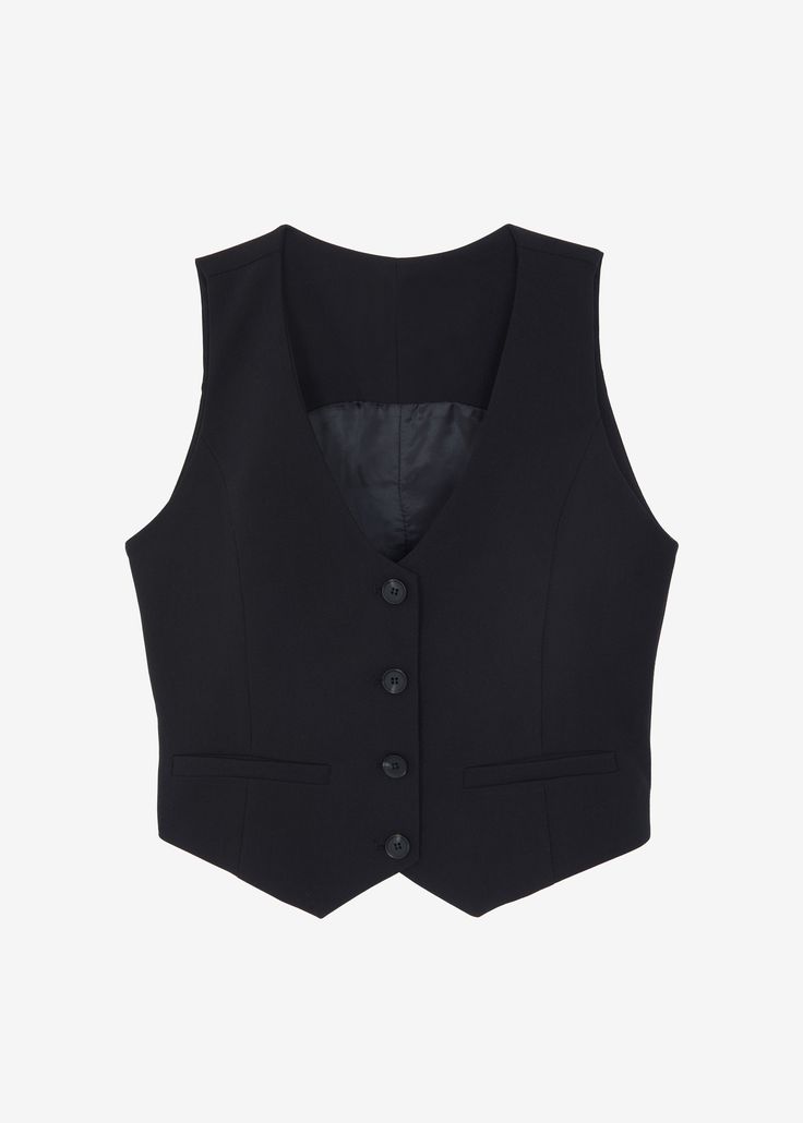 Color: Black Midweight suiting fabric Relaxed fit Cropped profile Sleeveless V neckline Adjustable back buckle Front illusion welt pockets Front button closure Lined 81% Polyester 15% Rayon 4% Elastane Dry Clean By The Frankie Shop. Imported Leslie Aesthetic, Black Vest Outfits For Women, Sleevless Jacket, Suit Vest Women, Black Vest Outfit, Black Vest Top, Black Suit Vest, Vest Outfits For Women, Plain Vest