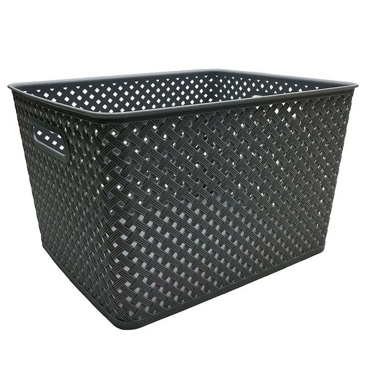 a black plastic basket with holes on the sides and handles is shown in front of a white background