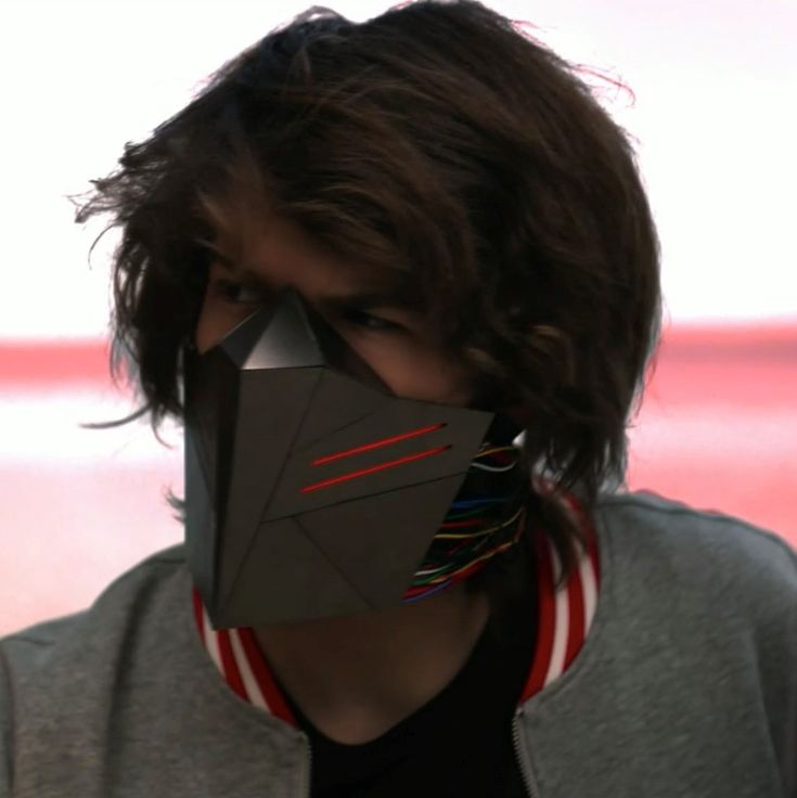 a person with a paper mask covering their face