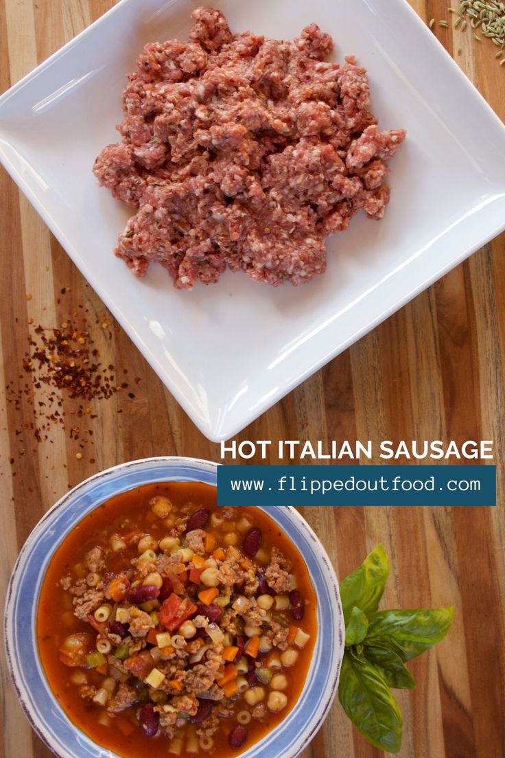 a bowl of soup and a plate of meat patties on a wooden table with basil leaves