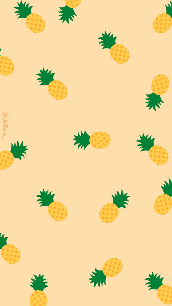 pineapples on a yellow background with green leaves